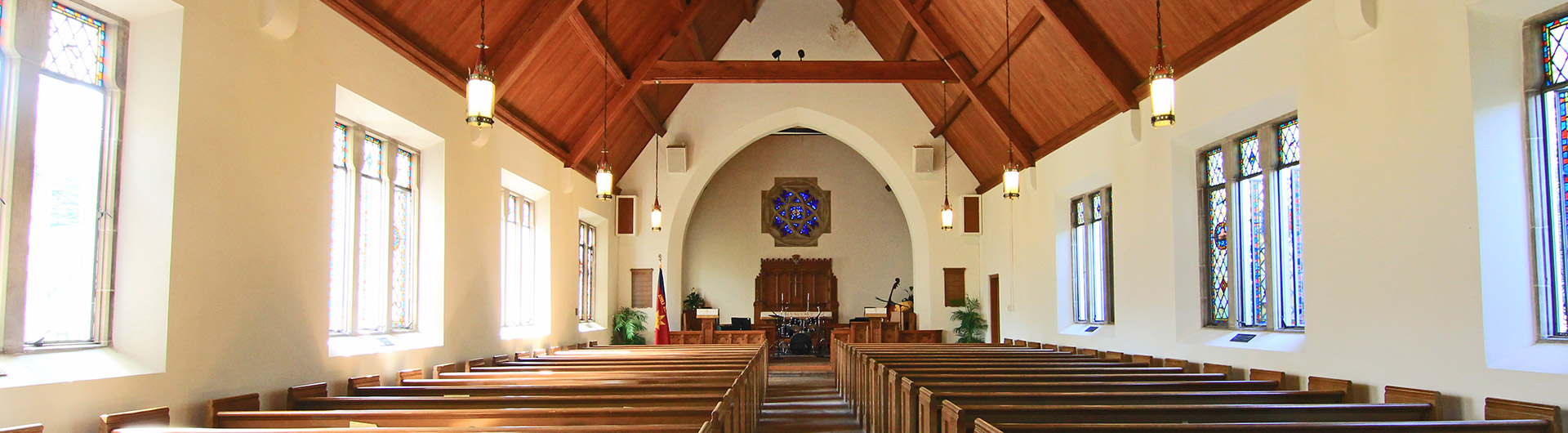View of a church from the back pews facing the altar