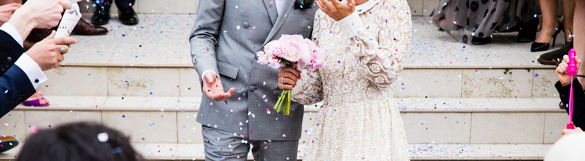 Newly Married couple standing on stairs at celebration