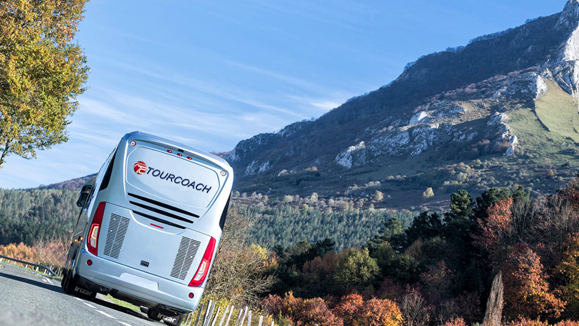 Traveling TourCoach bus by mountain